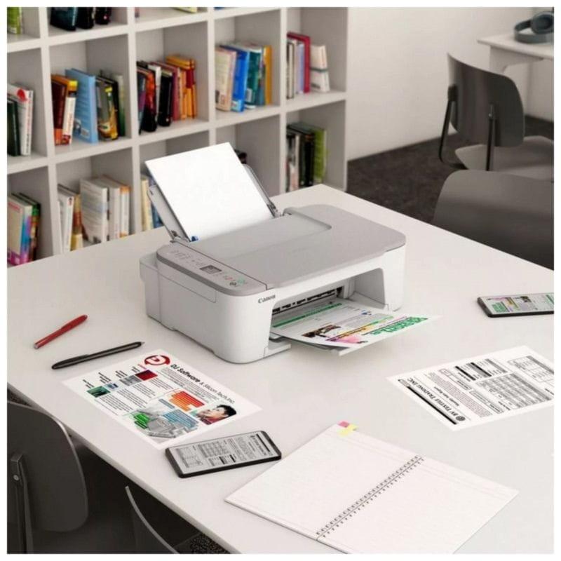 Vue d'ensemble de l'imprimante à jet d'encre Canon PIXMA TS3551i WiFi Blanc sur la table