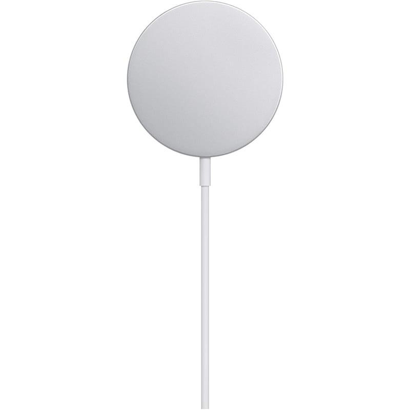 Chargeur Apple Magsafe rond argenté avec surface magnétique lisse et câble blanc fin intégré, design minimaliste pour fixation rapide et stable