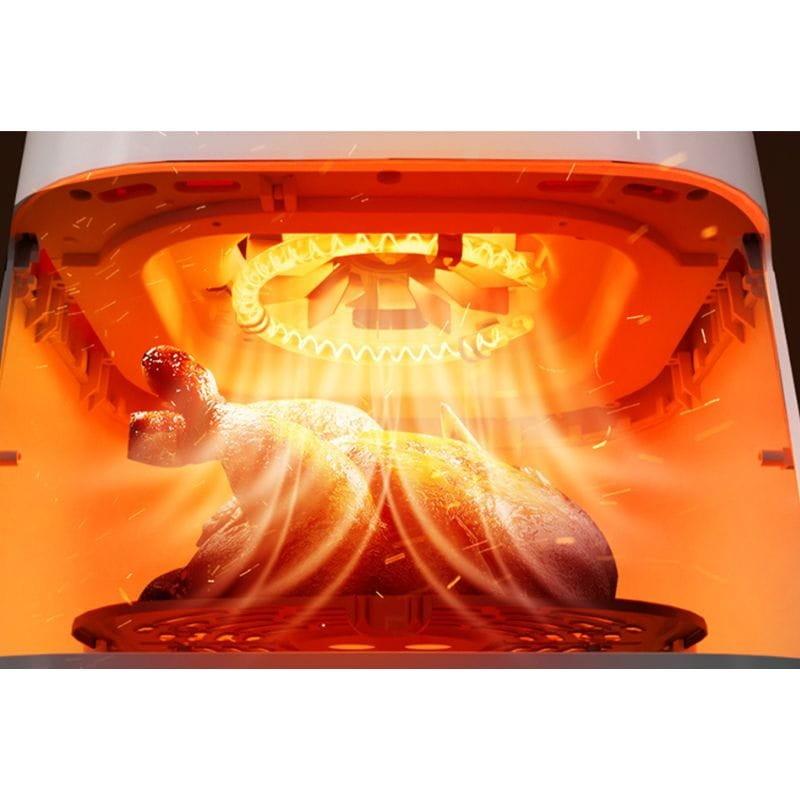 Deerma DEM-KZ130W - Imagem real da fritadeira de ar a cozinhar um frango