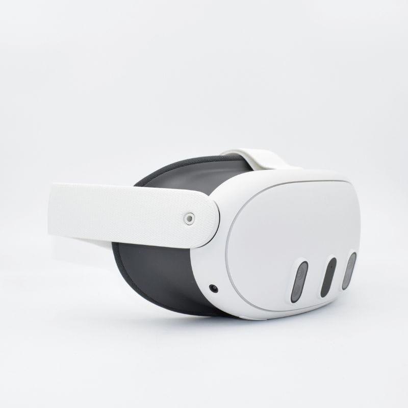 Casque VR blanc au design épuré, façade ovale avec trois capteurs, mousse grise confortable et sangle ajustable robuste. Modèle 512 Go rénové état