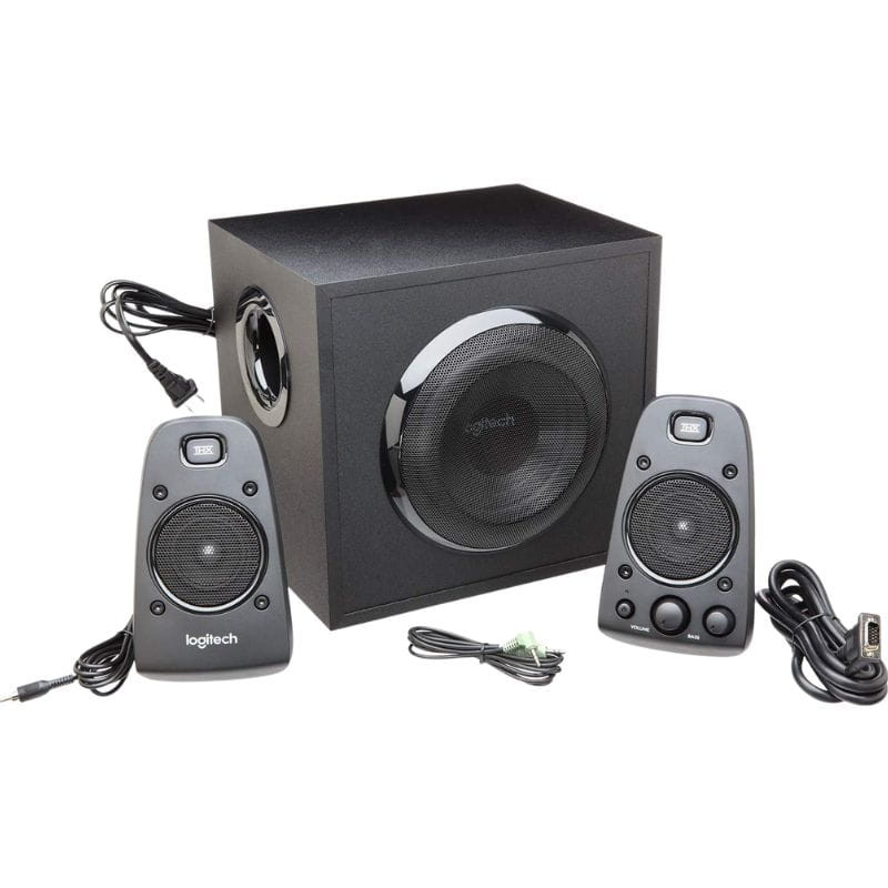 Sistema de altavoces 2.1 Logitech Z623: subwoofer cúbico negro con rejilla metálica y dos satélites compactos con controles frontales y cables incluidos.