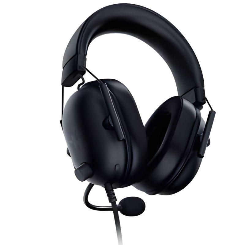 Caja del Razer BlackShark V2 X: auriculares negros con micrófono desmontable, diadema acolchada y copas ovaladas; empaques blanco y azul con asa superior.