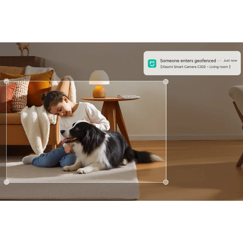 Xiaomi Smart Camera C302 3MP 2K WiFi 6 en sala moderna, detecta movimiento con alerta en pantalla, captura nítida, ideal para vigilar niños y mascotas