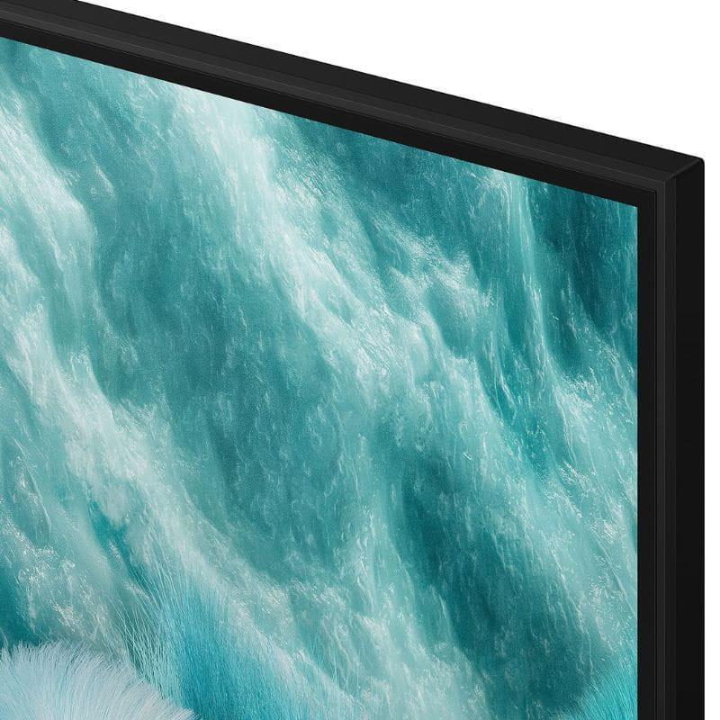 Borde delgado negro con pantalla QLED 65 pulgadas mostrando textura azul turquesa; panel 4K con colores vibrantes y alto contraste Quantum HDR