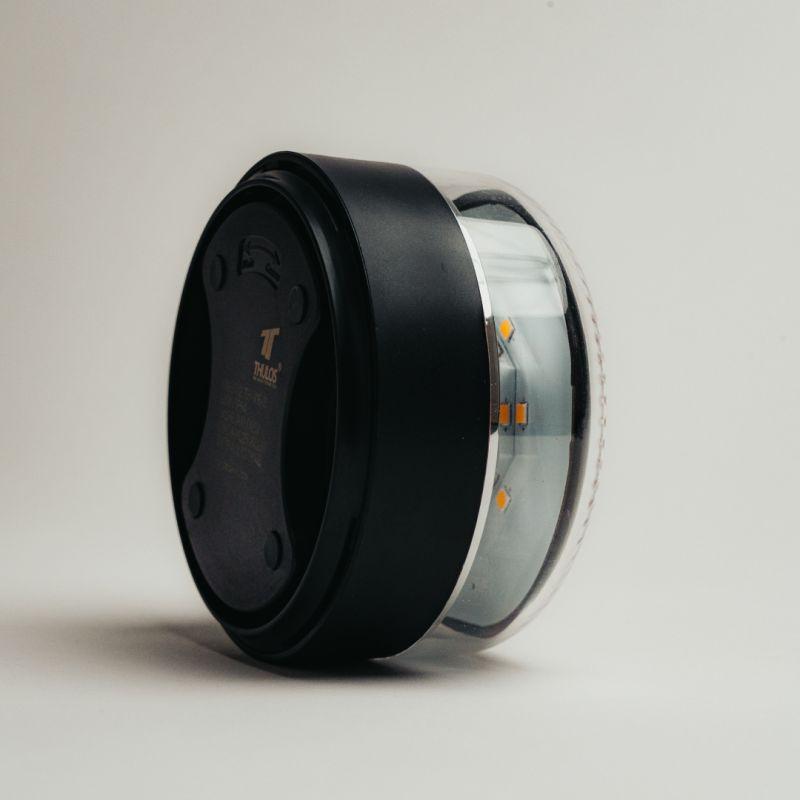 Balise de détresse Thulos TH-V16-2 homologuée, boîtier rond noir avec coque transparente, LED internes visibles, étui protecteur robuste et compact