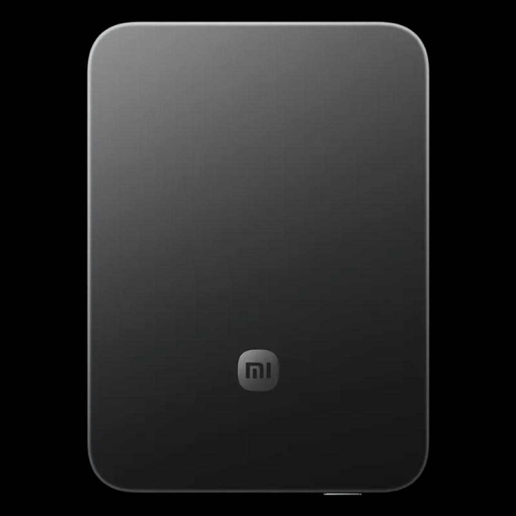Power bank magnético ultradelgado negro con acabado mate, bordes redondeados y logo mi al centro