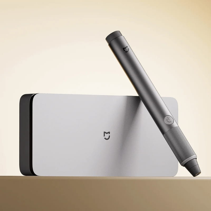 Xiaomi Mijia Rotary Tool Kit: caneta rotativa cinza com botão lateral, corpo metálico texturizado e estojo compacto prateado com logotipo Mijia