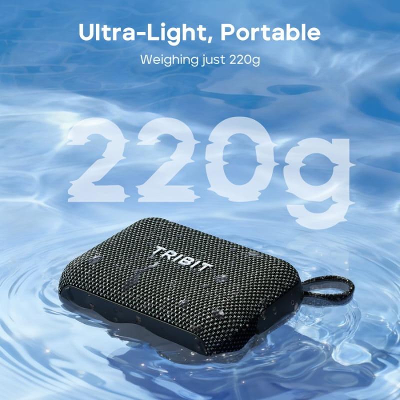 Tribit Pocket Go 7W Noir, mini enceinte noir charbon avec grille tressée, format rectangulaire arrondi, dragonne latérale, flottant sur l’eau, ultra
