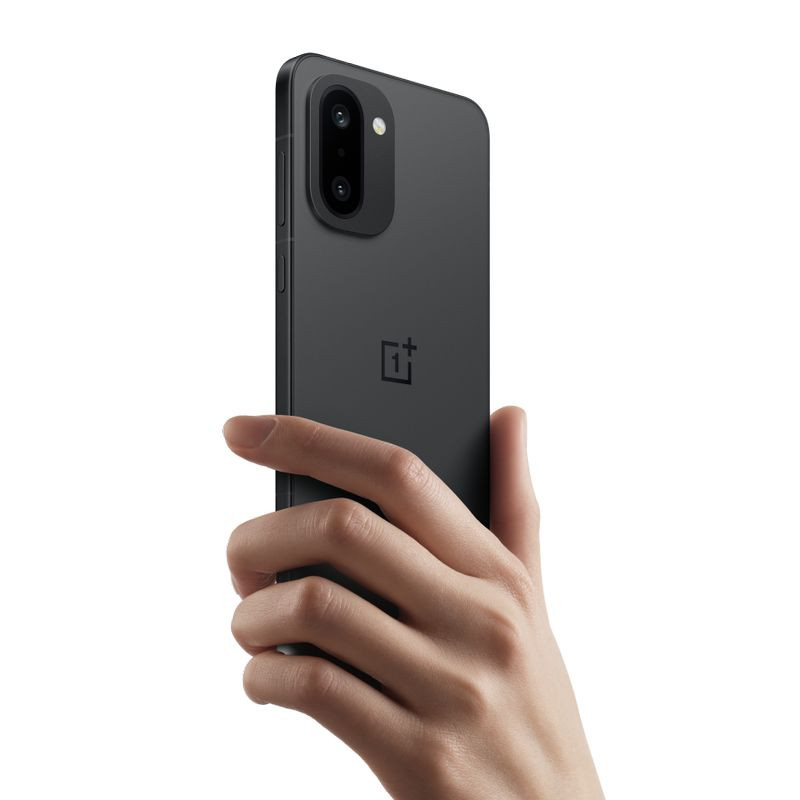 Oneplus 15R 5G 12GB/512GB Negro con acabado mate, marco fino y doble cámara trasera en módulo rectangular; logo OnePlus centrado en la tapa trasera