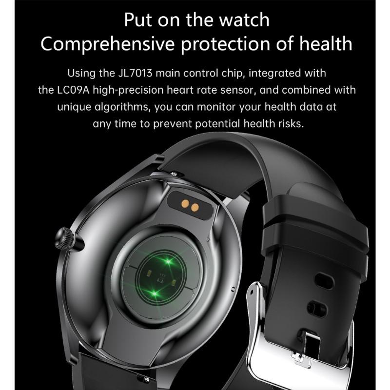 TN99 Smartwatch avec bracelet silicone noir, boîtier rond métal, capteur cardiaque vert au dos, boucle argentée, suivi santé et appels Bluetooth