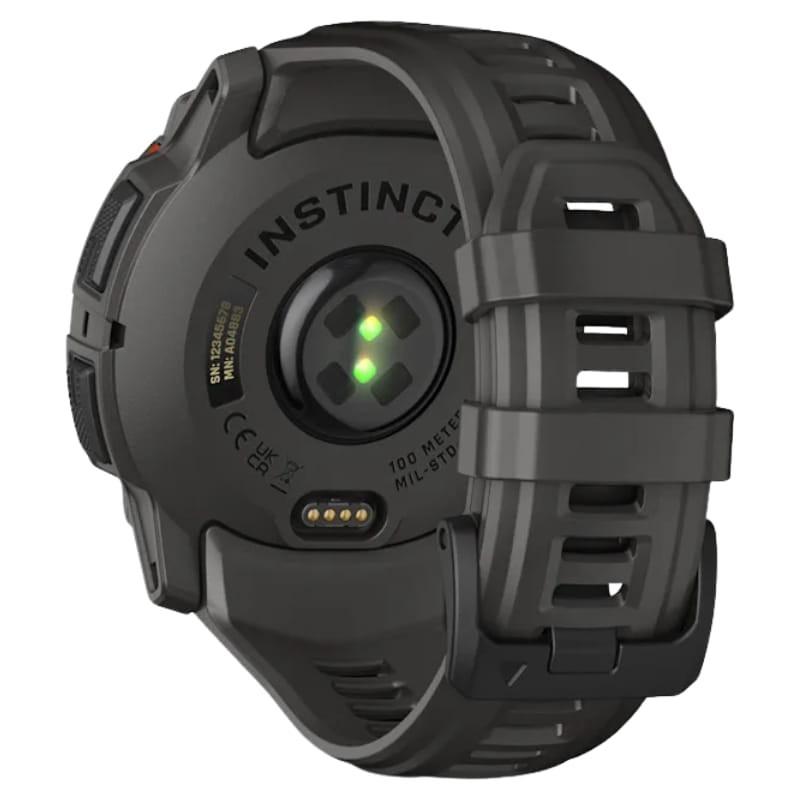 Parte trasera de Garmin Instinct 3 50mm Solar Negro: sensor óptico verde, carga con pines, correa de silicona carbón robusta con cierre ajustable NFC