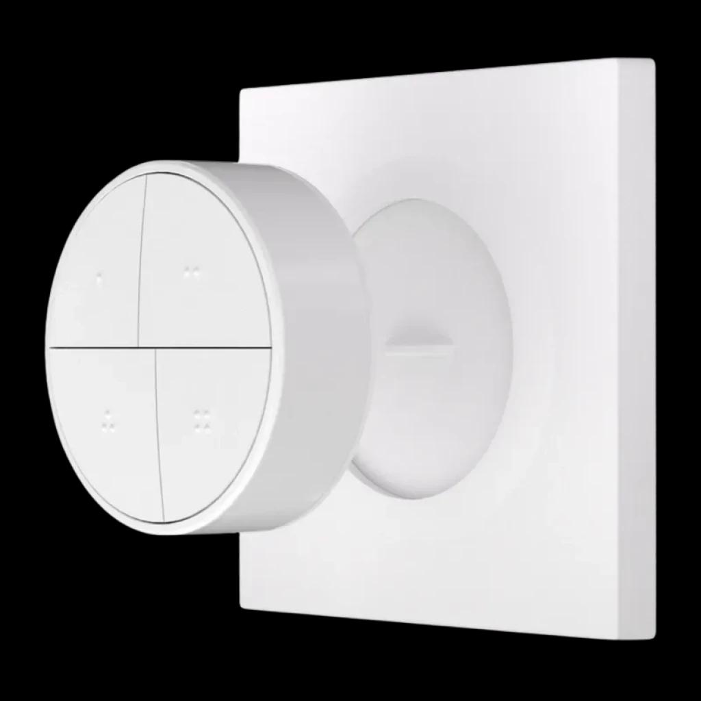 Botón inalámbrico ZigBee 4 en 1 blanco, forma circular con base cuadrada, cuatro zonas táctiles con puntos en relieve, diseño minimalista para pared