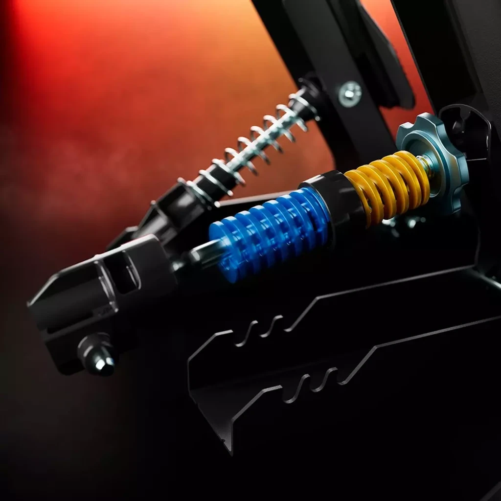 Muelle de pedal con resortes azul y amarillo y ajuste por perilla, construcción metálica robusta y ranuras de montaje para la pedalera Thrustmaster RACE