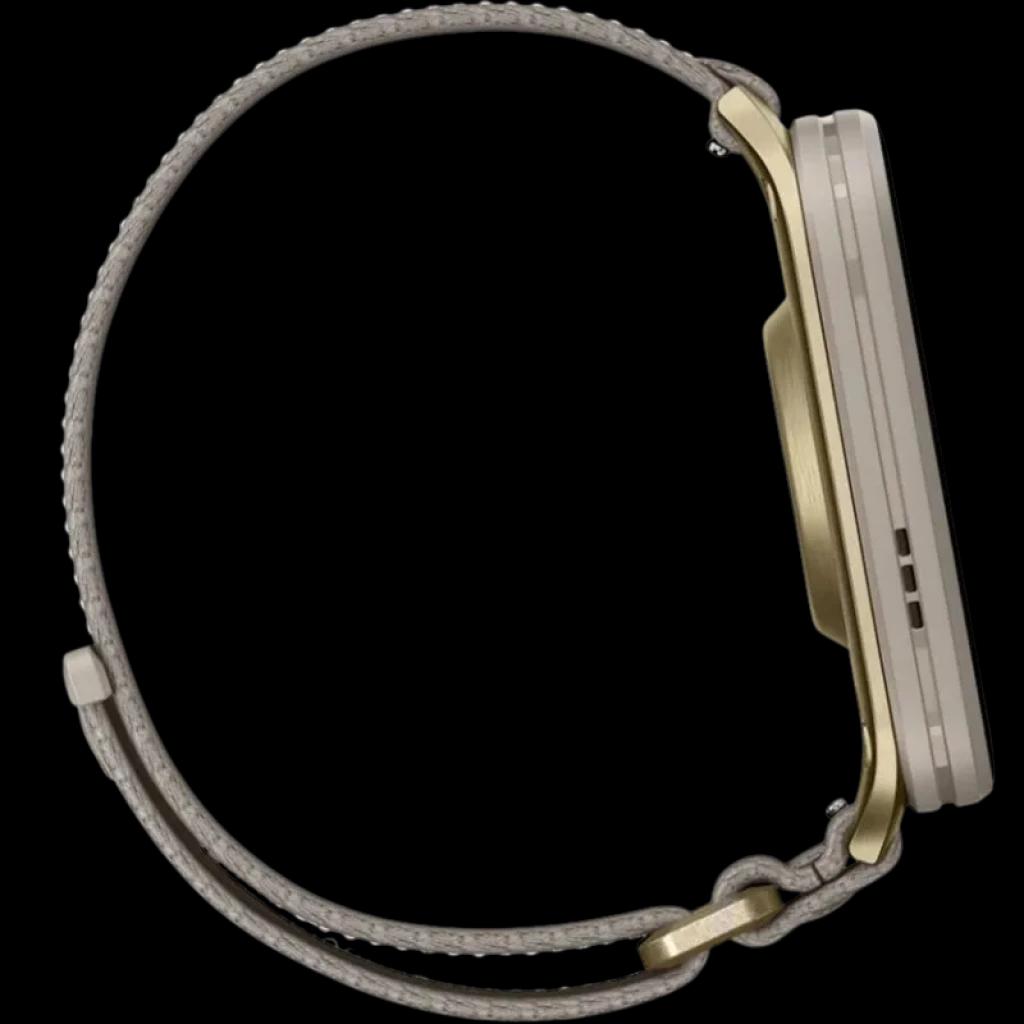 Garmin Venu X1 con caja de titanio dorada y correa de nailon ComfortFit gris; perfil delgado, hebilla metálica y diseño ligero y elegante