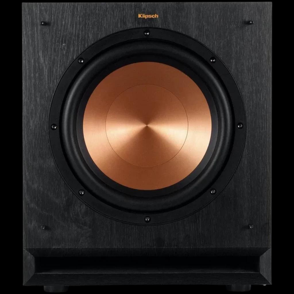 Klipsch SPL 120 CE subwoofer ativo com cone de 12 pol em cobre, frente preta texturizada e porta frontal, design robusto e elegante para graves potentes
