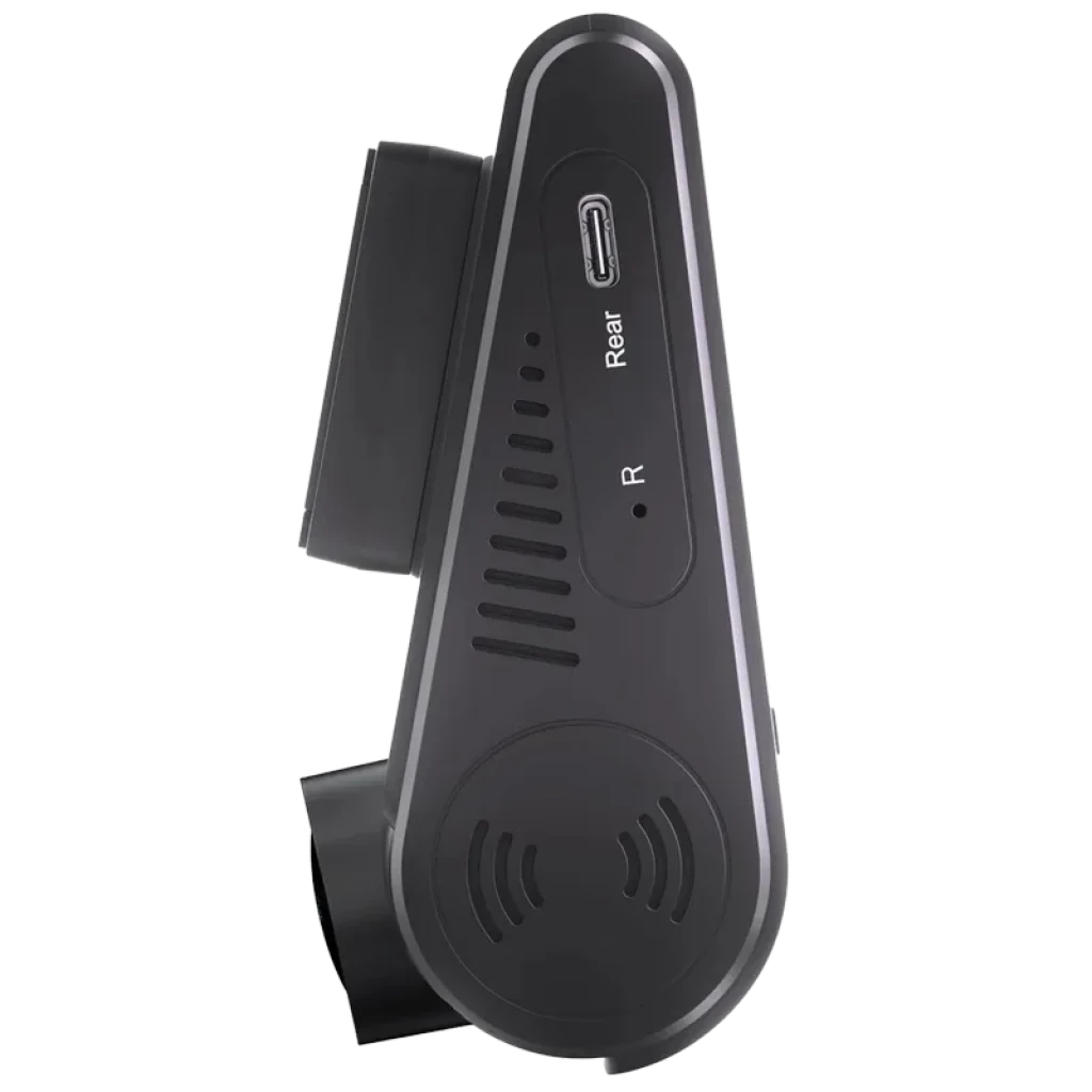 Cámara trasera compacta con puerto USB-C etiquetado Rear, ventilación lateral y diseño en negro mate; forma triangular para montaje discreto en parabrisas o