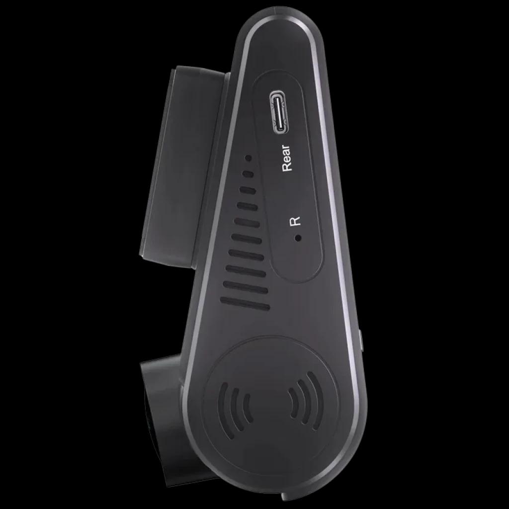 Cámara trasera compacta con puerto USB-C etiquetado Rear, ventilación lateral y diseño en negro mate; forma triangular para montaje discreto en parabrisas o