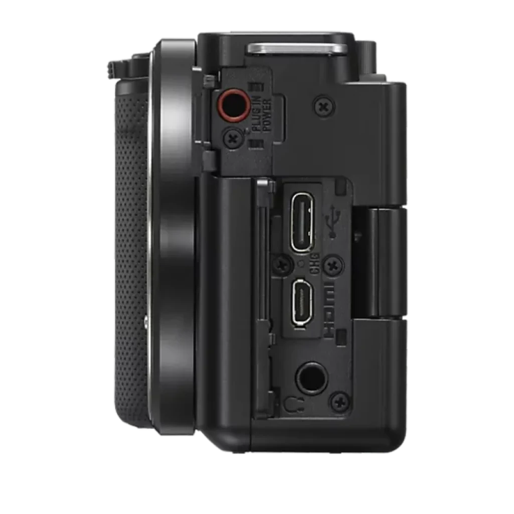 Sony Alpha ZV-E10 con puertos laterales: USB, micro HDMI y micrófono, botón rojo de grabación y pantalla articulada ideal para vlogging en 4K