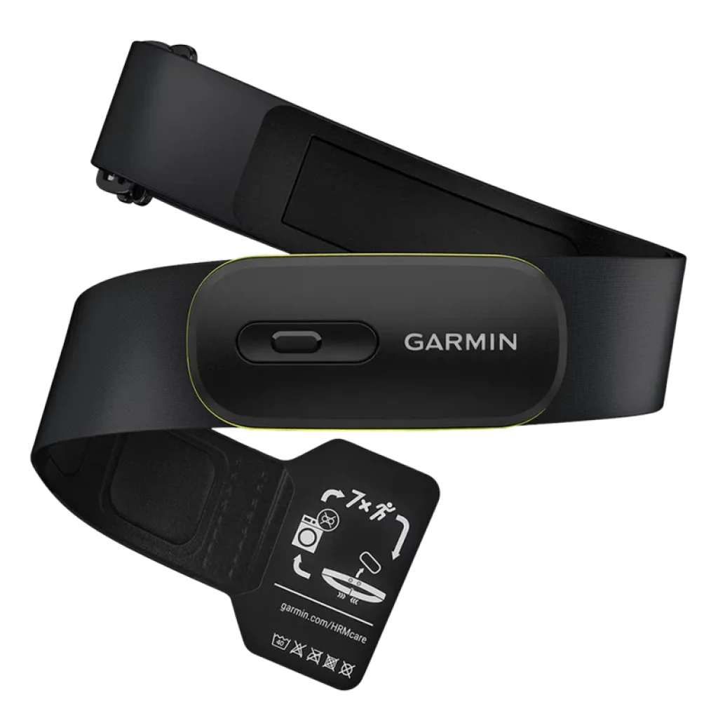 Banda pectoral Garmin HRM 600 XS-S en negro con módulo central y borde verde, correa ajustable y etiquetas de cuidado; diseño compacto y recargable