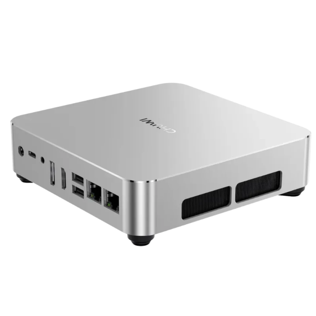 Chuwi AuBox Mini PC plateado, compacto con chasis metálico, puertos frontales USB y Ethernet, rejillas de ventilación frontales y patas antideslizantes