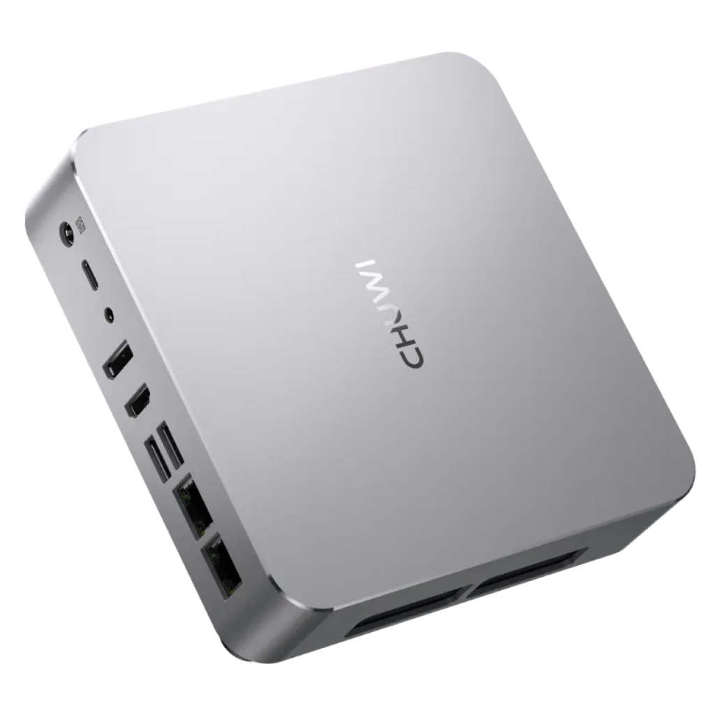 Mini PC Chuwi AuBox plateado, compacto con carcasa metálica. Puertos frontales y laterales: USB, HDMI, Ethernet y audio. Logo CHUWI en la tapa.