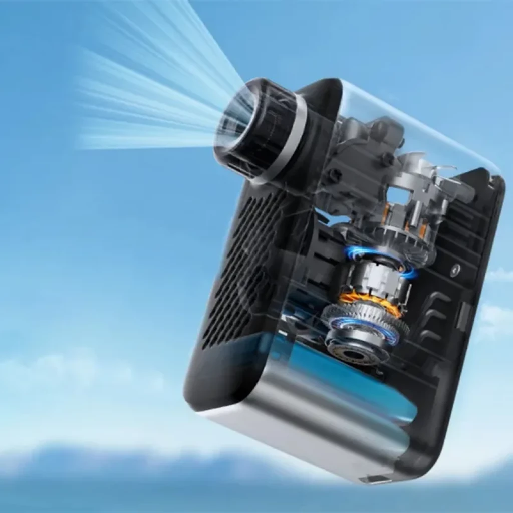 Fanttik X10 Ace Tiny 120 PSI 130g mini bomba eléctrica con carcasa transparente, muestra motor y engranajes internos, boquilla frontal expulsando aire