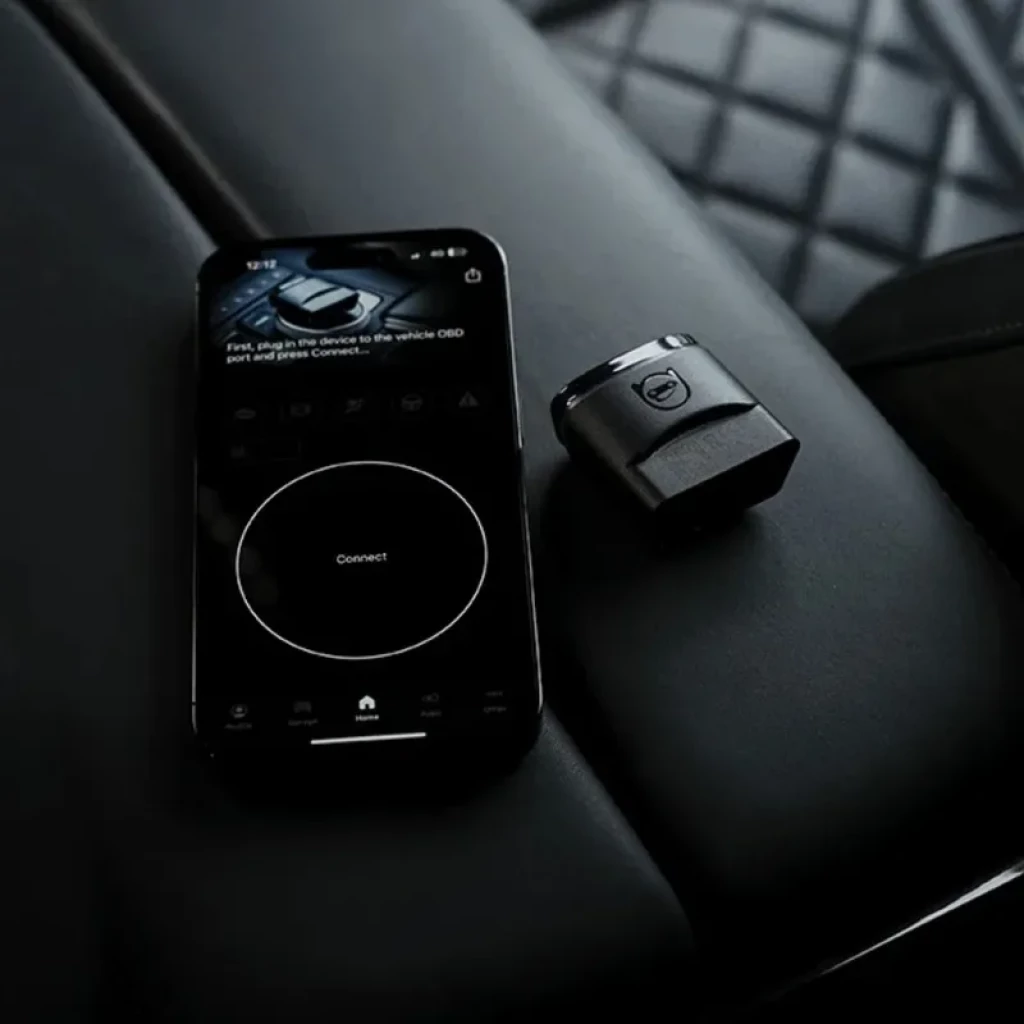 Escáner de diagnóstico OBDeleven 2 Pro Pack Codificación VAG Bluetooth BLE con dongle compacto OBD y app móvil en pantalla oscura, diseño moderno y