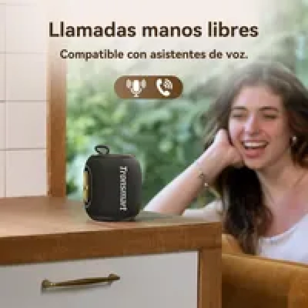 Tronsmart T8 Mini 16 W IPX7 enceinte compacte noire avec boucle, grille avant et radiateurs latéraux dorés, posée sur un plan de travail, idéale mains