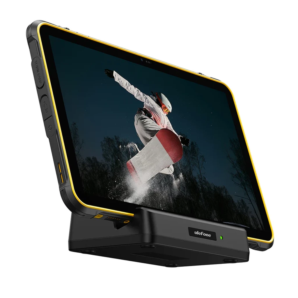 Tablet robusta Ulefone RugKing Pad 2 Pro negra con marco amarillo, pantalla amplia, botones laterales texturizados y base de carga con indicador LED