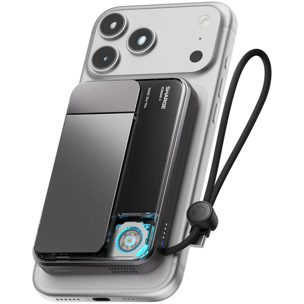 Power bank magnético negro con ventilador visible, enfriamiento activo, carga Qi2 25W, 10000 mAh, indicador LED y correa, acoplado a un smartphone plateado
