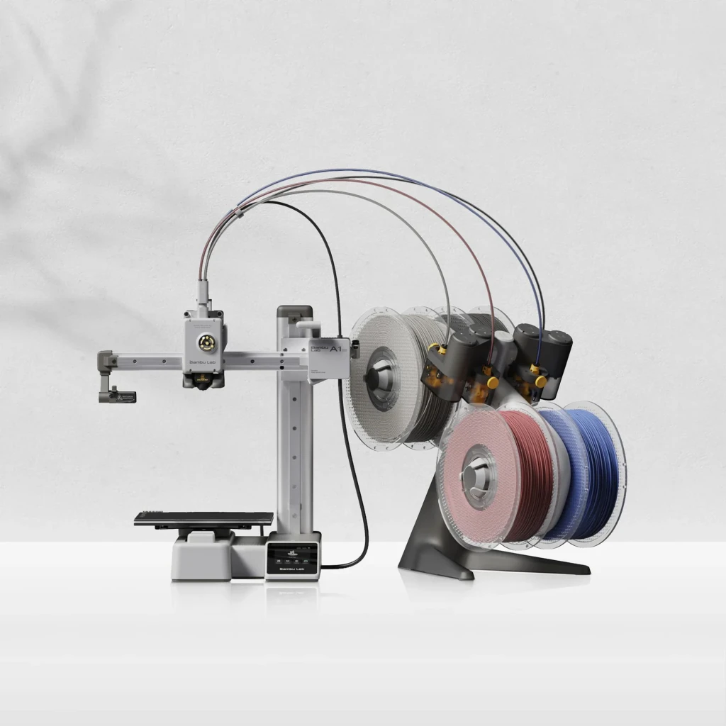 Bambu Lab A1 Mini con cámara integrada, impresora 3D compacta con sistema multicolor AMS, bobinas visibles y estructura metálica en acabado gris
