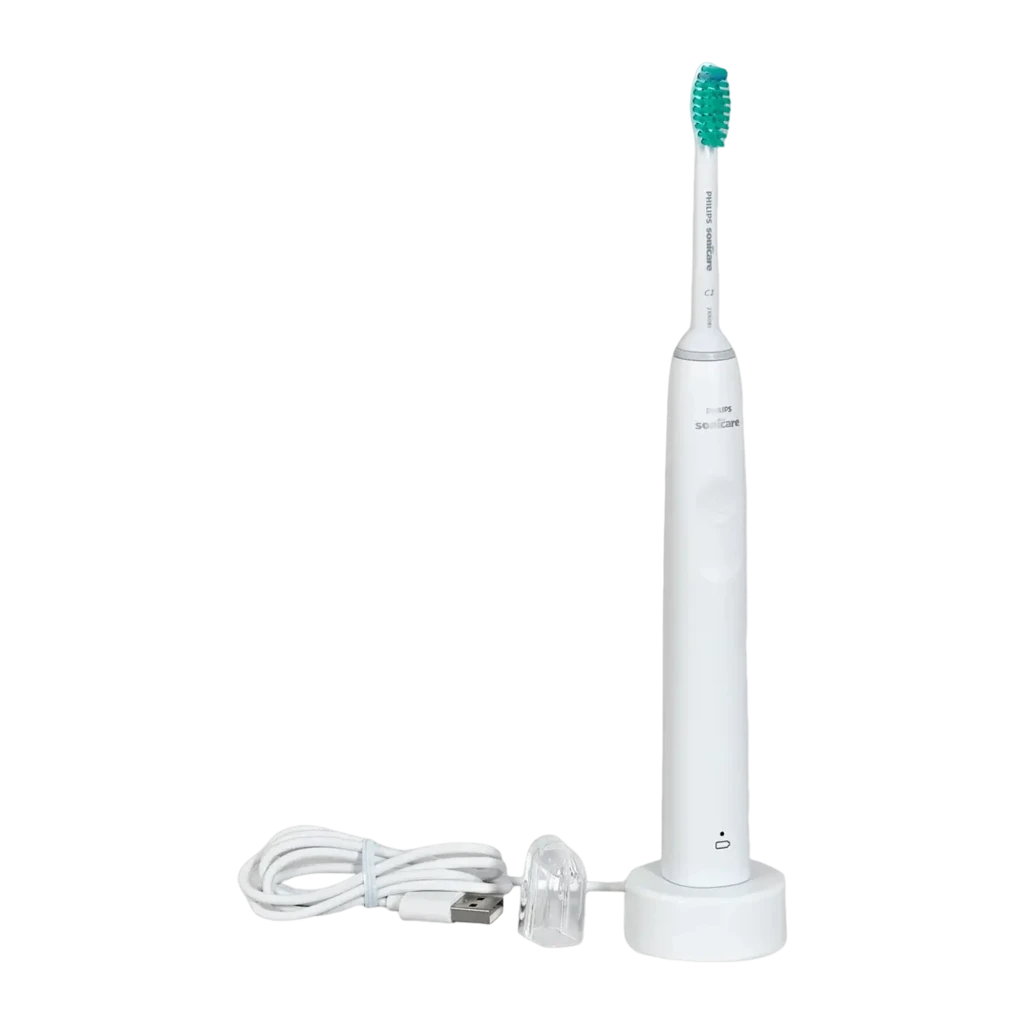 Philips Sonicare 2100 Series HX3651/13 blanco, vista frontal: cepillo en base cargadora con cable USB enrollado en el suelo