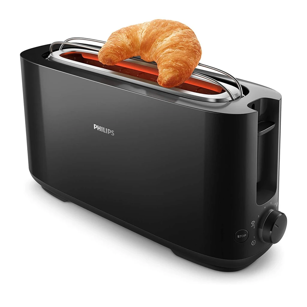 Philips Tostadora HD2590/90 Daily Collection negro, vista lateral: croissant sobre rejilla calentadora, ranura larga