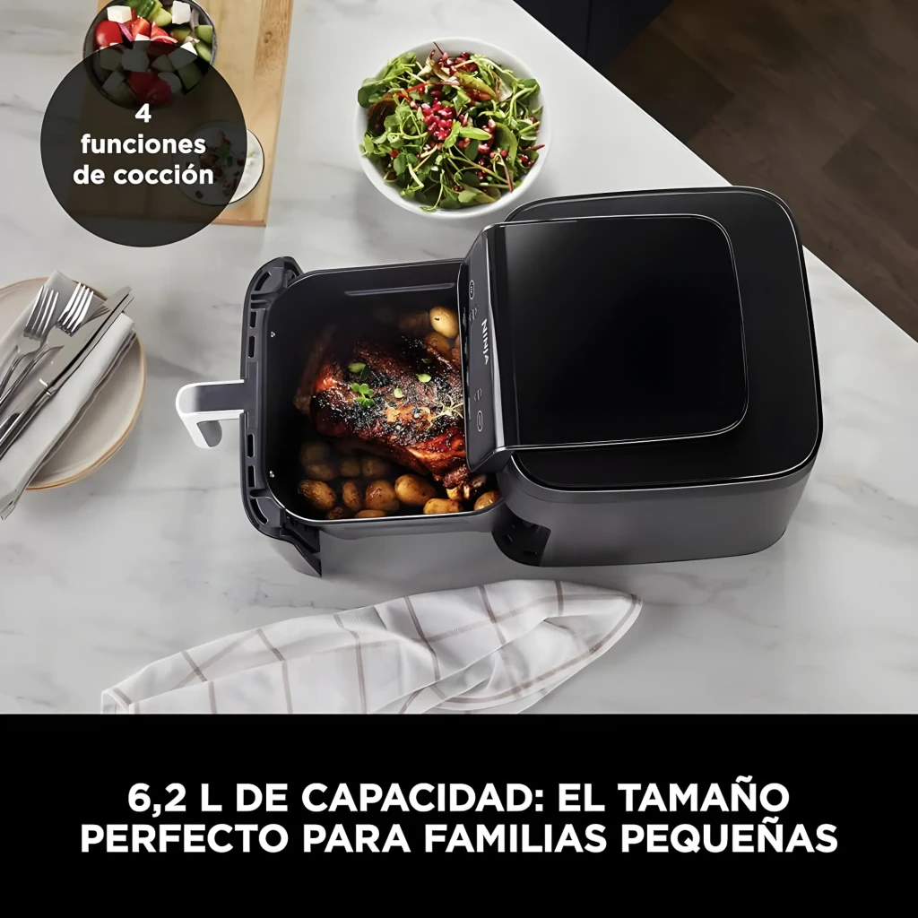 Ninja Freidora Aire AF170EU 6.2L Negro, cesta abierta: pollo asado con patatas dentro, encimera mármol