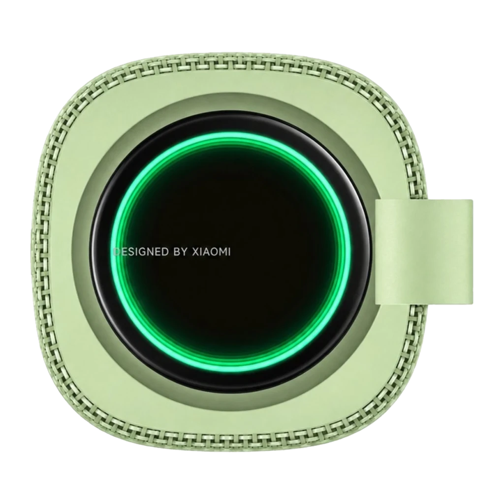 Altavoz portátil verde con aro LED luminoso, diseño cuadrado con bordes redondeados y correa lateral; textura trenzada alrededor del marco