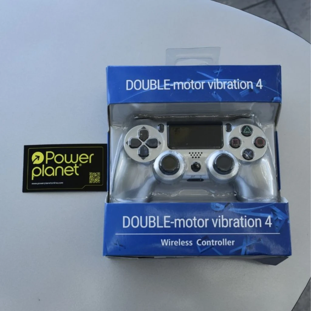 Mando PS4 blanco con panel táctil, botones clásicos PlayStation, joysticks dobles y altavoz integrado, presentado en caja Double-motor vibration 4