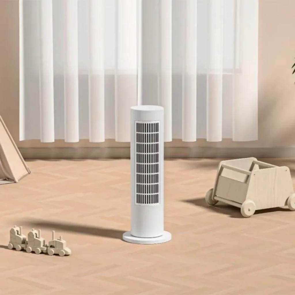 Calefactor Eléctrico Xiaomi Smart Tower Heater Lite en torre blanca, diseño minimalista con rejilla frontal vertical y base redonda estable para calentar