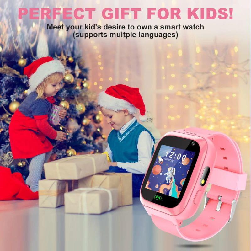 Smartwatch pour enfants A7 2G Rose avec écran couleur, bracelet rose ajustable, bouton latéral vert, caméra frontale et interface festive lumineuse
