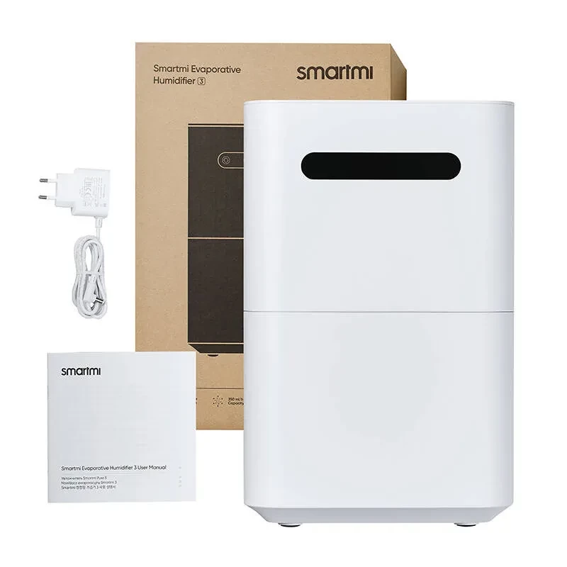 Xiaomi Smartmi Evaporative Humidifier 3 en blanco, diseño minimalista con ranura frontal negra. Incluye adaptador de corriente y manual junto a la caja.