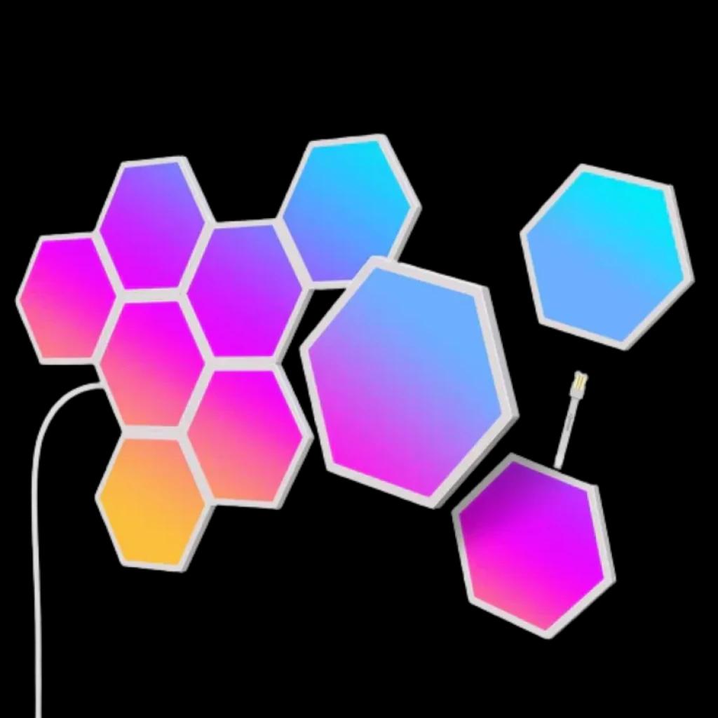 Panneaux hexagonaux RGBIC modulaires aux dégradés rose bleu orange, bords blancs, liaison câble visible, configuration murale flexible et lumineuse