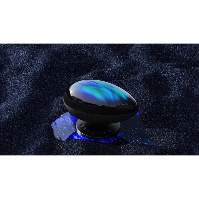 Proyector de Luz Wanbo EVA Galaxy Light con cúpula negra tipo guijarro, efectos aurora azul y verde, base redondeada y controles frontales iluminados