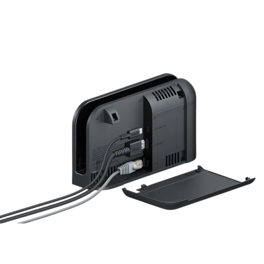 Base Nintendo Switch 2 vista traseira com tampa removida, três cabos conectados, portas HDMI e USB visíveis, design preto fosco com grelhas de ventilação