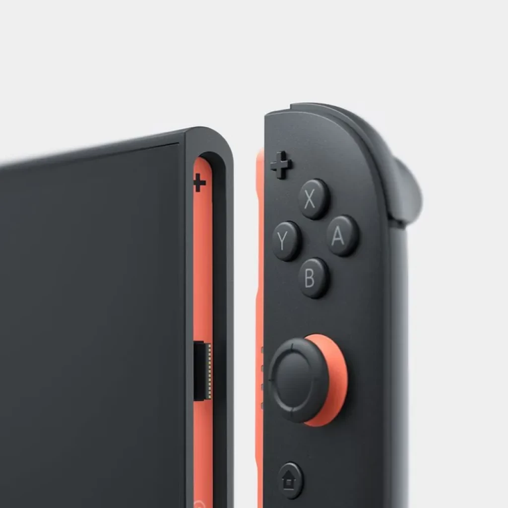 Nintendo Switch 2 - Renovado Estado Excelente con Joy-Con desmontable gris y detalles naranjas, botones A B X Y resaltados y pantalla negra sin biseles visibles