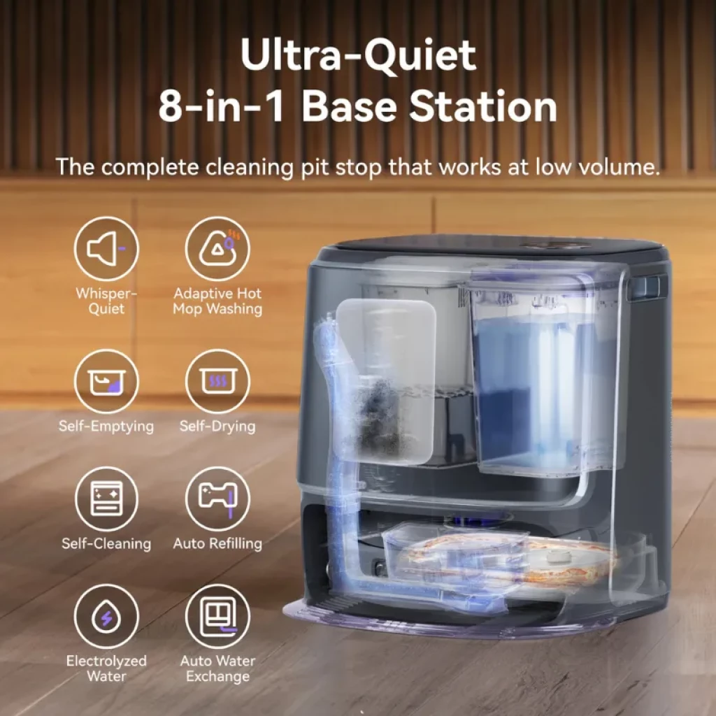 Narwal Freo Z ultra Extend avec base 8‑en‑1: station compacte gris foncé, bacs transparents, tuyaux visibles, tiroir de serpillères et affichage discret