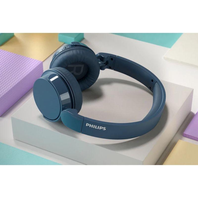 Philips 4000 Series TAH4209BL/00 Azul - Auriculares inalámbricos, imagen real sobre una mesa