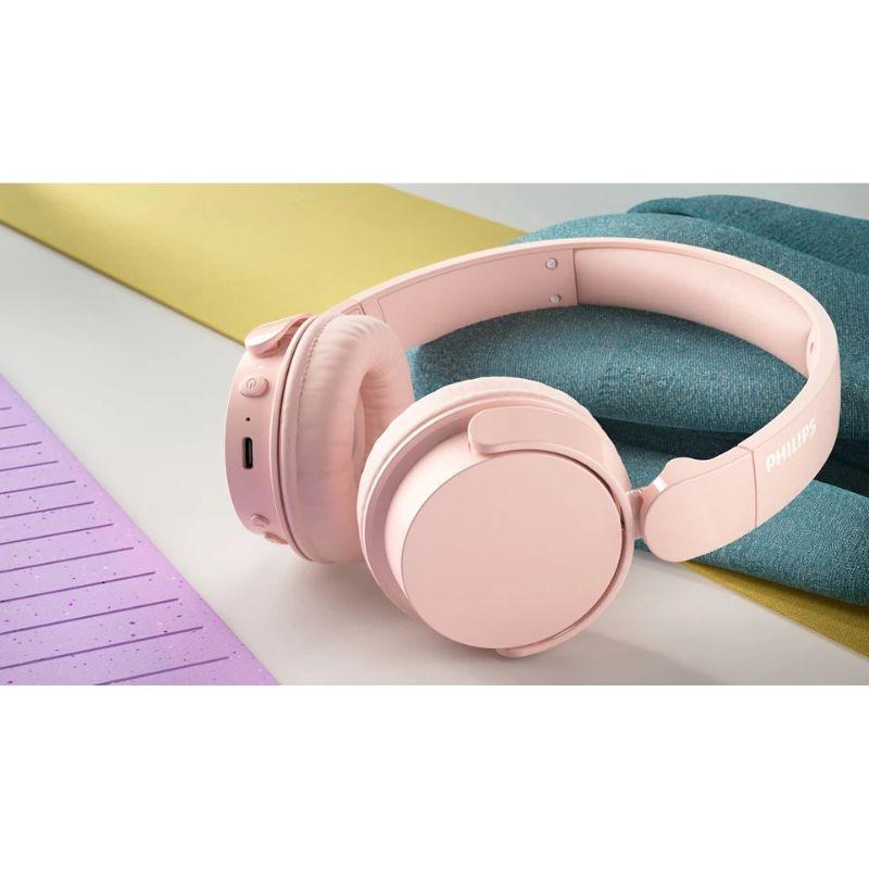 Philips 4000 Series TAH4209PK/00 Rosa - Auriculares inalámbricos, sobre una mesa