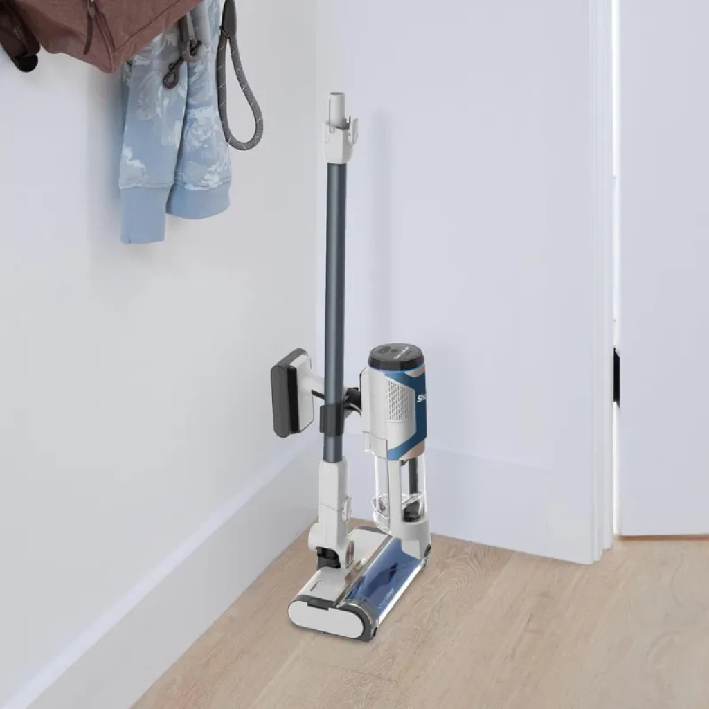 Base de carregamento compacta com aspirador sem fios Shark BU1120EU em branco e azul, depósito de 0,42 L, design vertical dobrável
