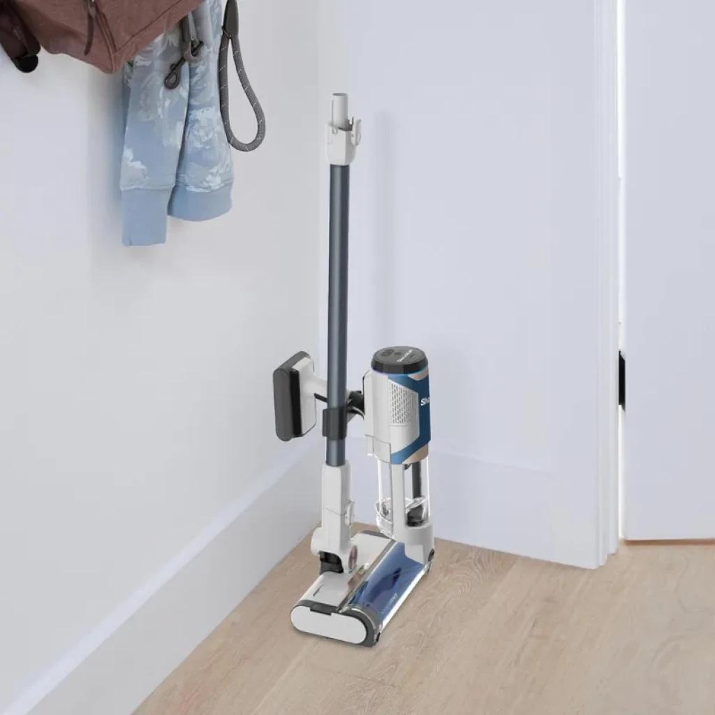 Base de carregamento compacta com aspirador sem fios Shark BU1120EU em branco e azul, depósito de 0,42 L, design vertical dobrável