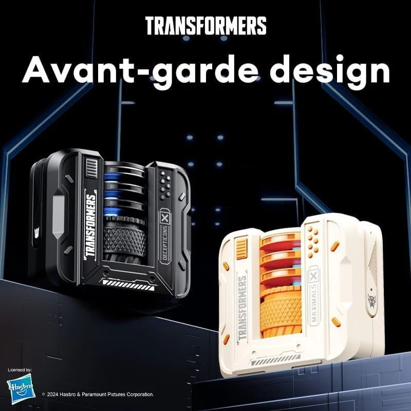 Transformers TF-T71 Creme: módulo compacto em creme com grelha laranja, detalhes cinza e logo Transformers; design futurista e linhas industriais.