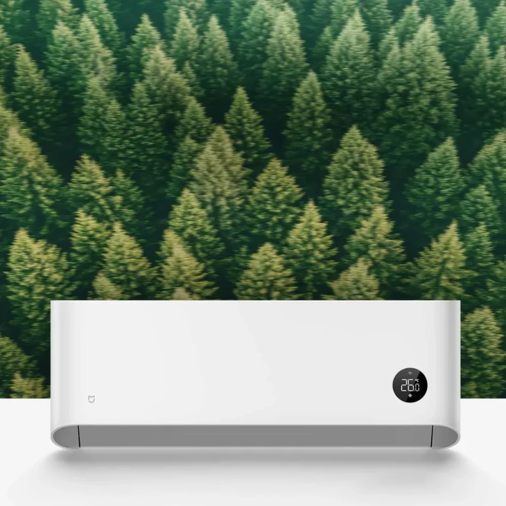 Aire acondicionado mural blanco Xiaomi Mijia Pro Eco 3.5 kW con pantalla circular LED que muestra 26 °C, diseño minimalista con salida de aire inferior y